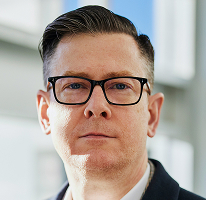 Alexander Hughes, administrerende direktør i en kryptohandelsvirksomhed, portræt